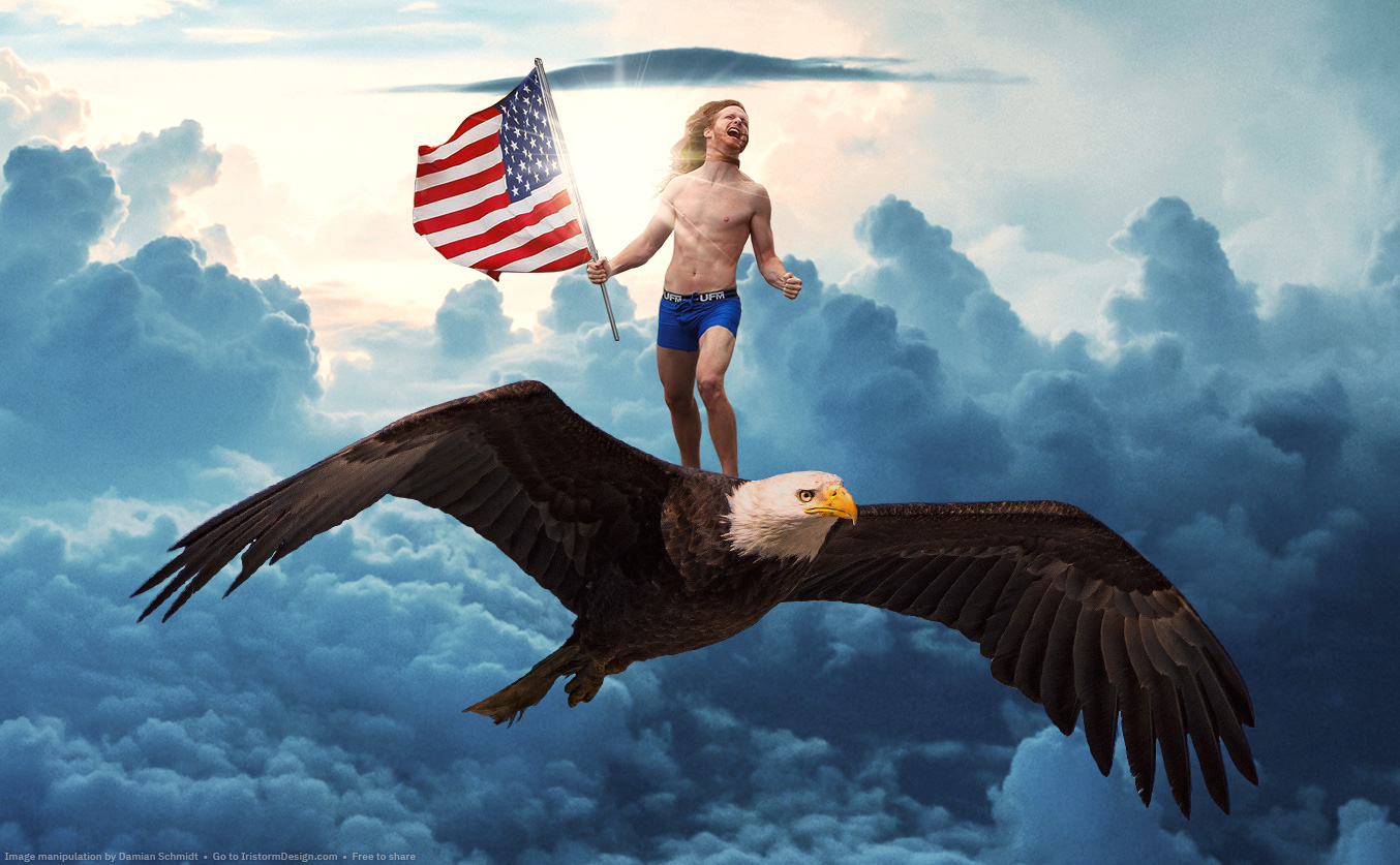 A near-naked guy holding an American flag and riding on a giant bald eagle