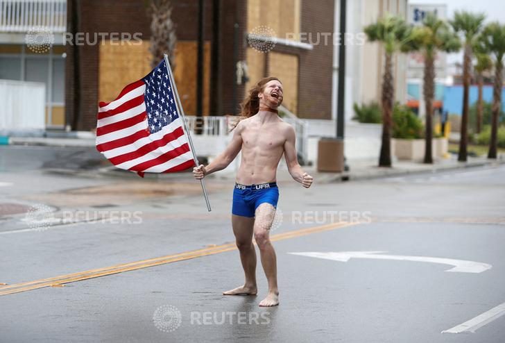 Patriotic underwear guy on a street during a hurricane